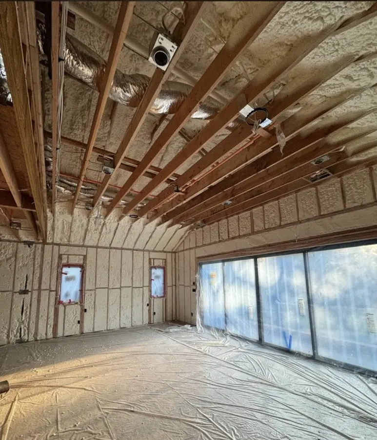 Interior walls and ceiling insulated with spray foam during new construction in Poteau